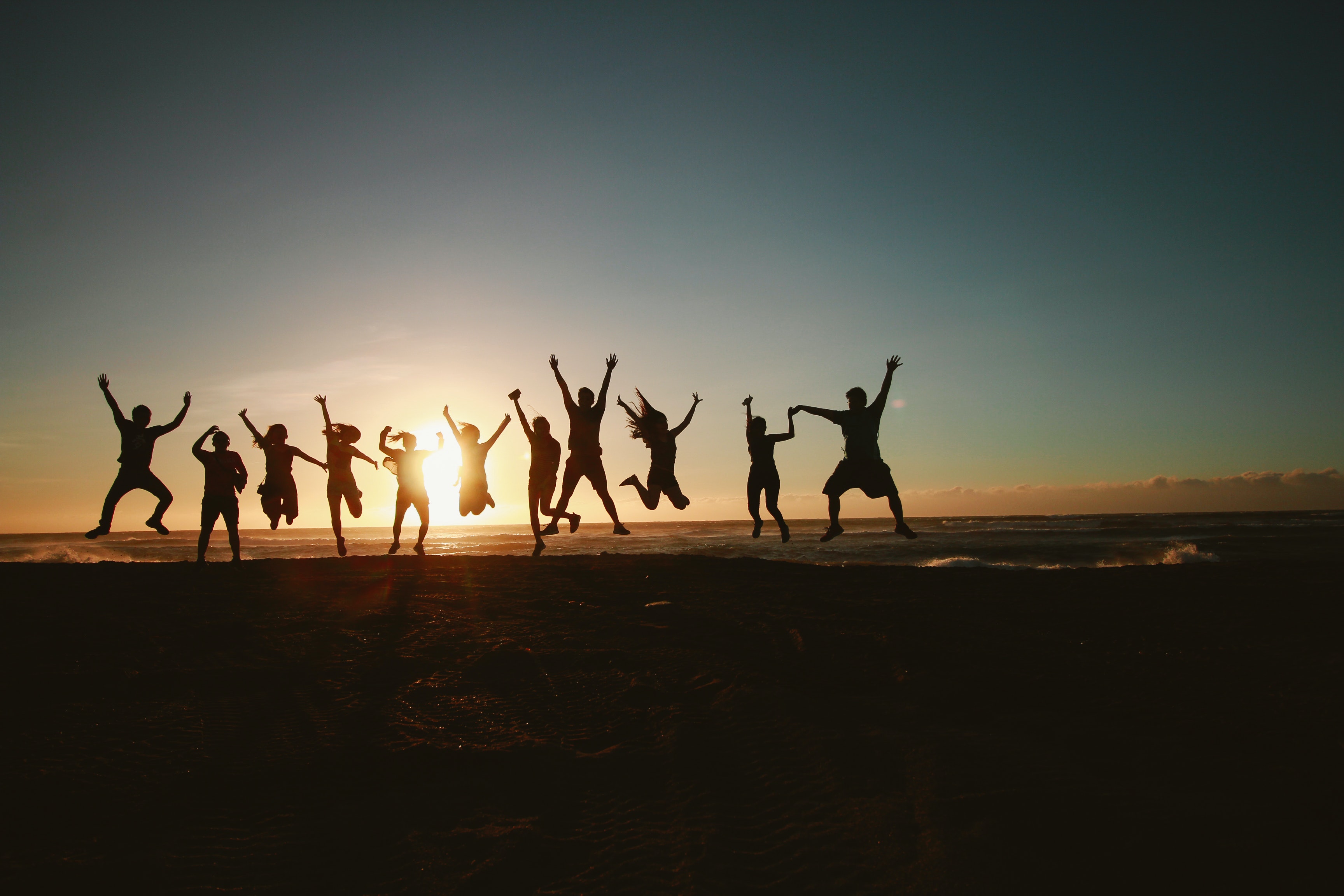 figures jumping by the beach; Photo by Belle Co from Pexels